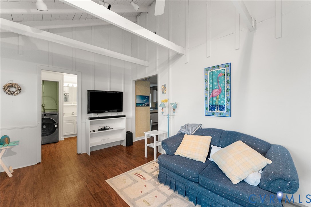 90 Deep Harbor Road Lancaster, VA 22503 - Photo 19 of 21 a living room with furniture and a flat screen tv