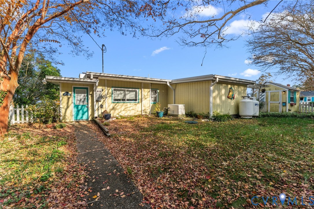 90 Deep Harbor Road Lancaster, VA 22503 - Photo 2 of 21 a view of a house with backyard and garden