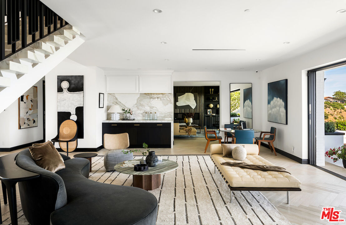 10932 Savona Road Los Angeles, CA 90077 - Photo 13 of 72 a living room with furniture and a table