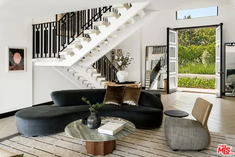 a kitchen with stainless steel appliances granite countertop a stove and a sink