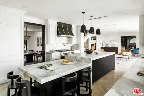 a view of a dining room with furniture and window