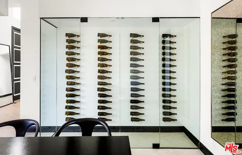 a room with furniture and view of living room