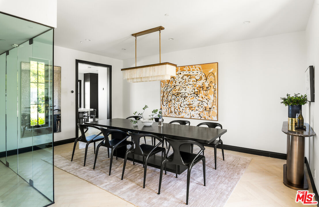10932 Savona Road Los Angeles, CA 90077 - Photo 26 of 72 a view of a dining room with furniture and window