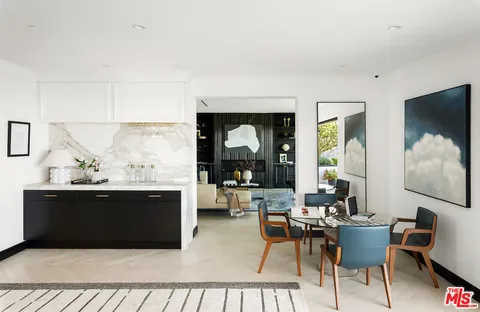 a en suite bathroom with a double vanity sink and a mirror