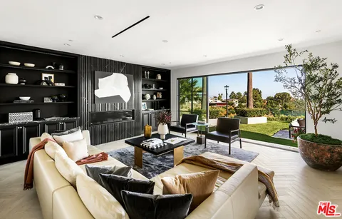 a living room with furniture and white walls