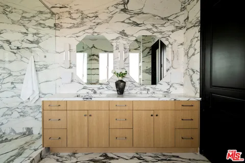 aerial view of a house with swimming pool garden and lake view