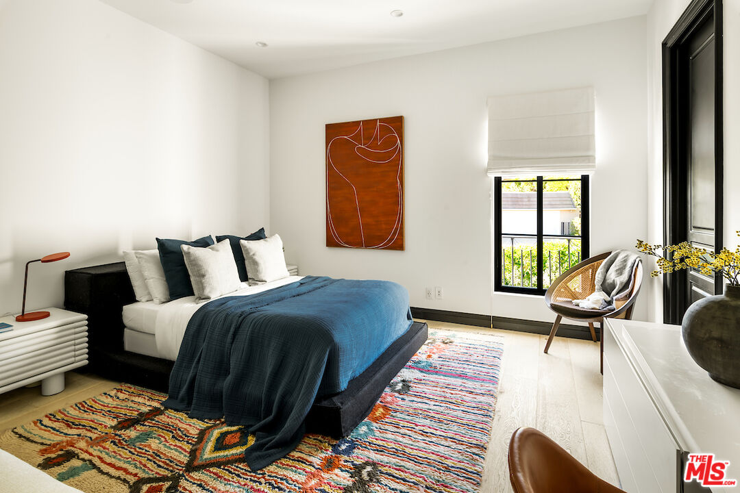 10932 Savona Road Los Angeles, CA 90077 - Photo 53 of 72 a bed room with a bed and a couch