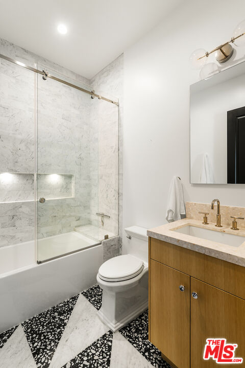10932 Savona Road Los Angeles, CA 90077 - Photo 56 of 72 a bathroom with a sink toilet and shower