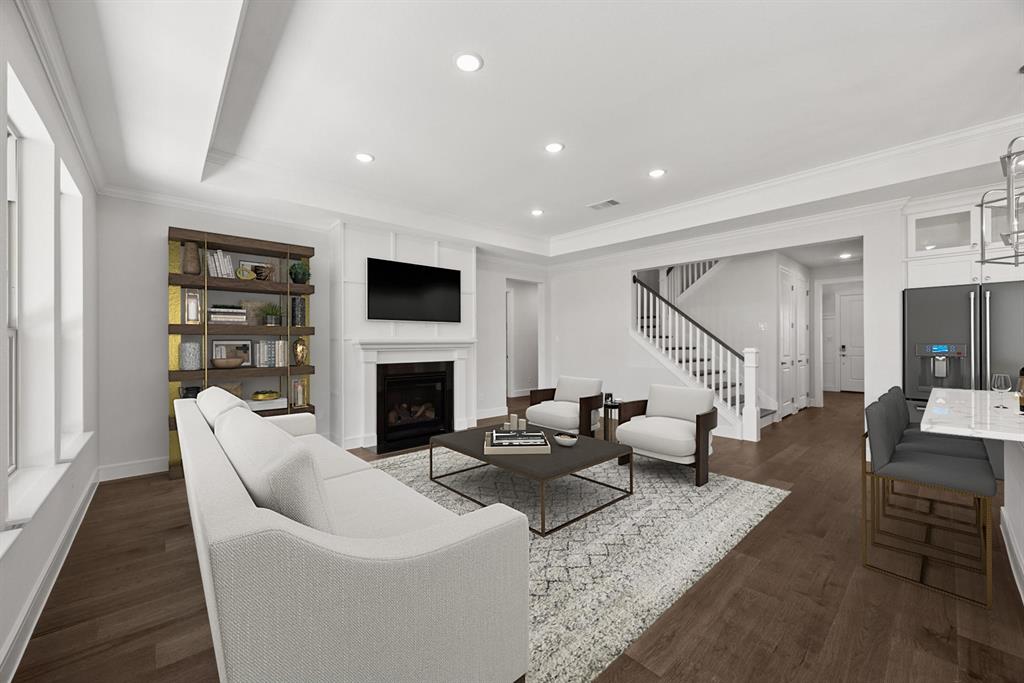 1317 Benjamin Trail Van Alstyne, TX 75495 - Photo 3 of 29 a living room with furniture a fireplace and a flat screen tv