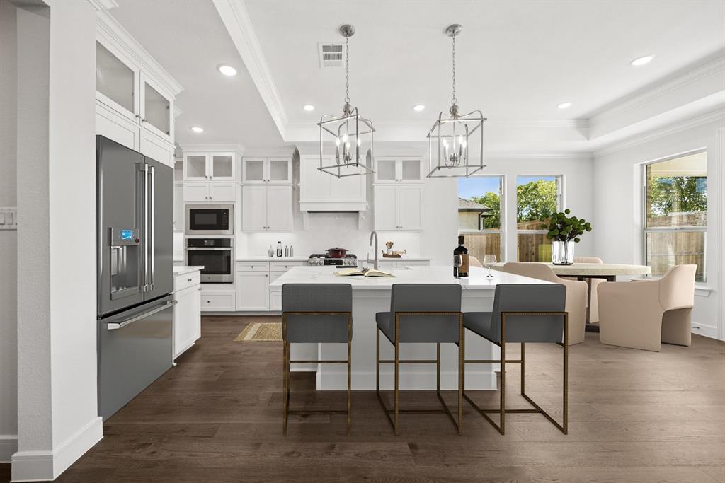 1317 Benjamin Trail Van Alstyne, TX 75495 - Photo 5 of 29 a view of a dining room and livingroom with furniture wooden floor a chandelier