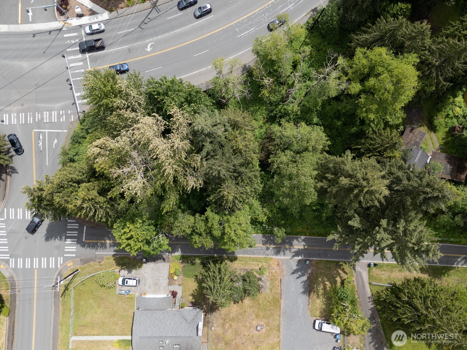 an aerial view of a house with a yard