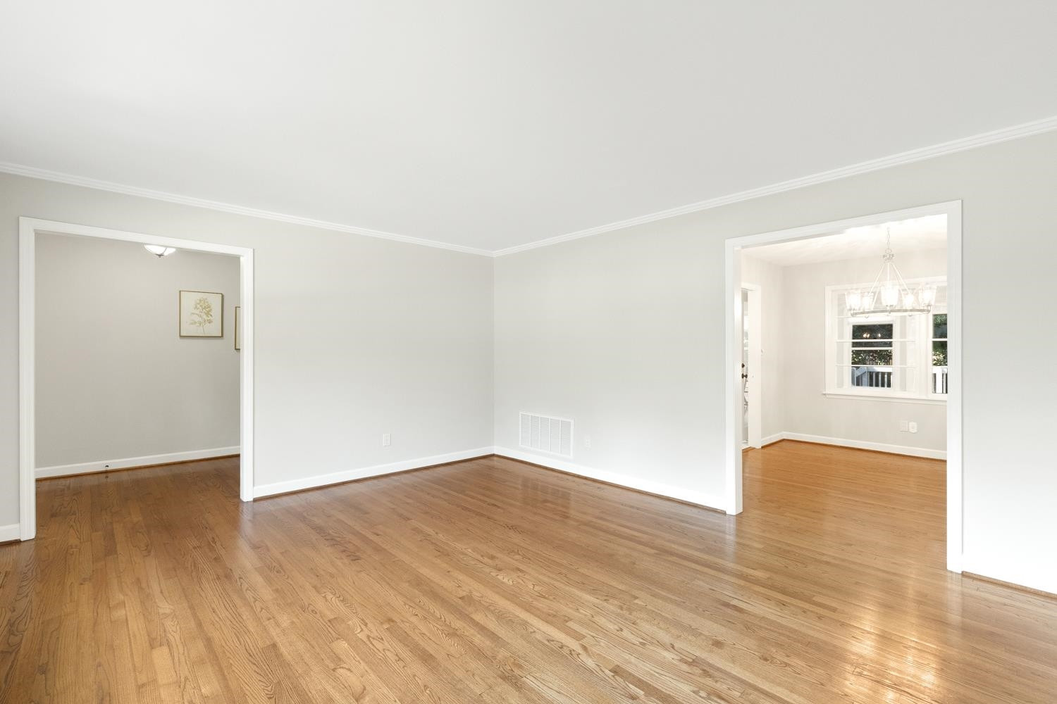 708 Dartmouth Road Raleigh, NC 27609 - Photo 6 of 15 The main level family room is spacious & bright with gleaming hardwoods. The dining room is off the family room. Family Room