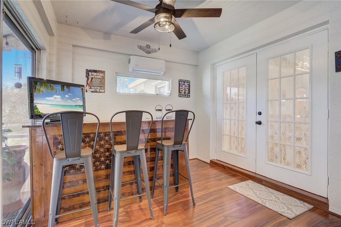 8337 Robin Road Fort Myers, FL 33967 - Photo 15 of 36 a view of a dining room with furniture window and wooden floor