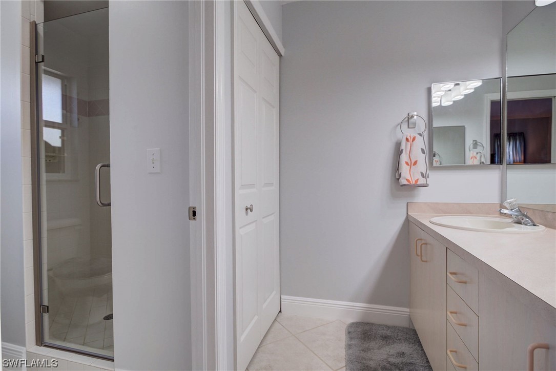 8337 Robin Road Fort Myers, FL 33967 - Photo 20 of 36 a bathroom with a sink and a mirror