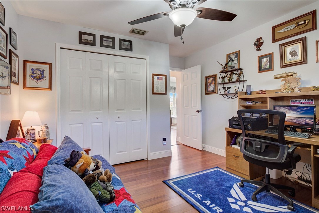 8337 Robin Road Fort Myers, FL 33967 - Photo 23 of 36 a living room with furniture and a wooden floor