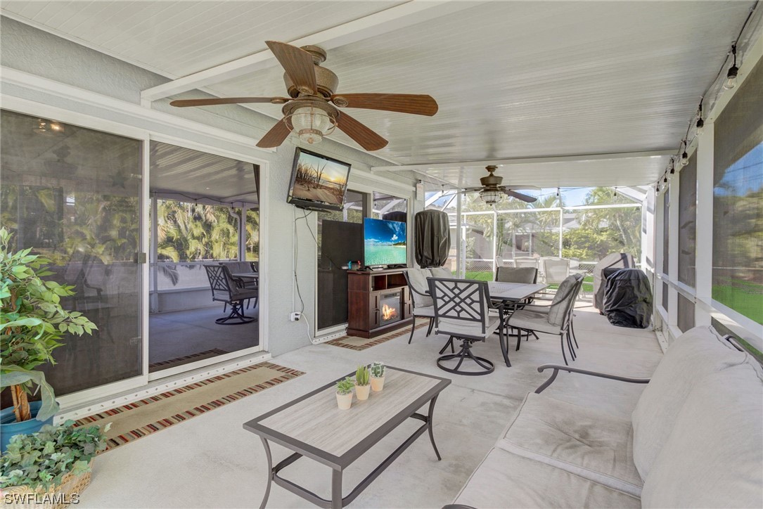 8337 Robin Road Fort Myers, FL 33967 - Photo 24 of 36 a view of a patio with a table and chairs