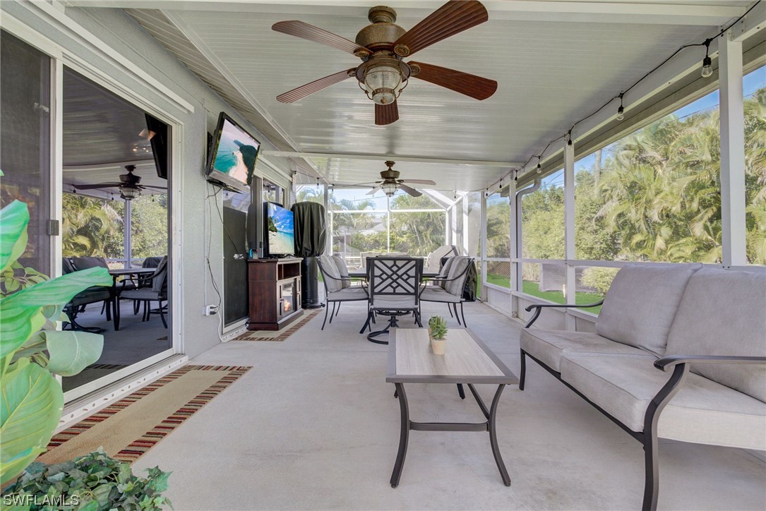8337 Robin Road Fort Myers, FL 33967 - Photo 25 of 36 a dining room with furniture a chandelier and a rug