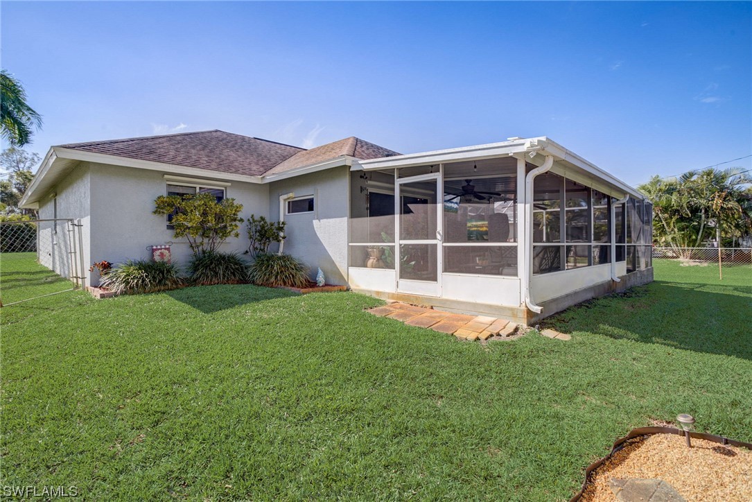 8337 Robin Road Fort Myers, FL 33967 - Photo 31 of 36 a view of an house with backyard space and garden