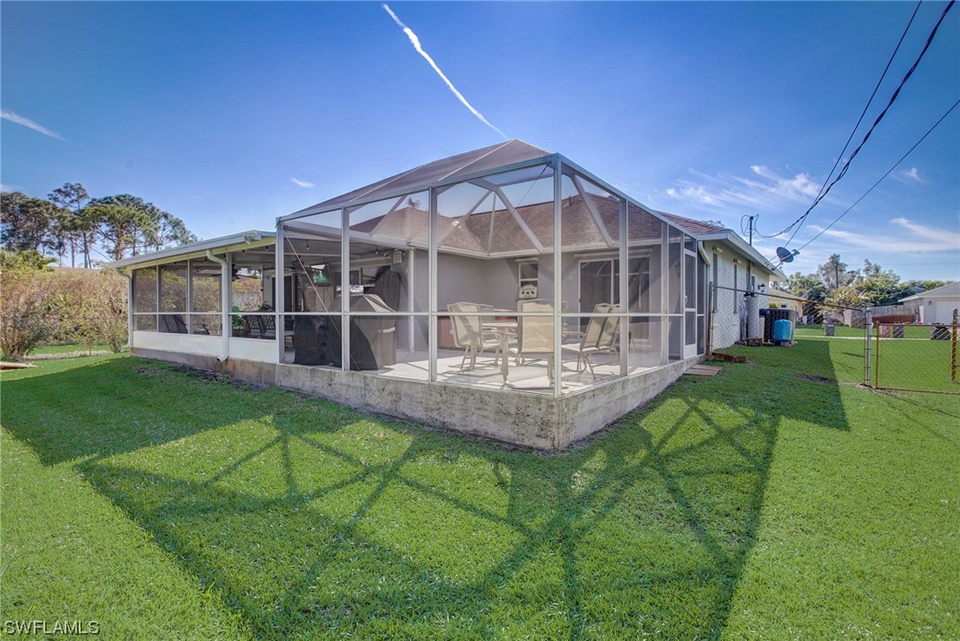 8337 Robin Road Fort Myers, FL 33967 - Photo 32 of 36 a view of a house with a yard and sitting area