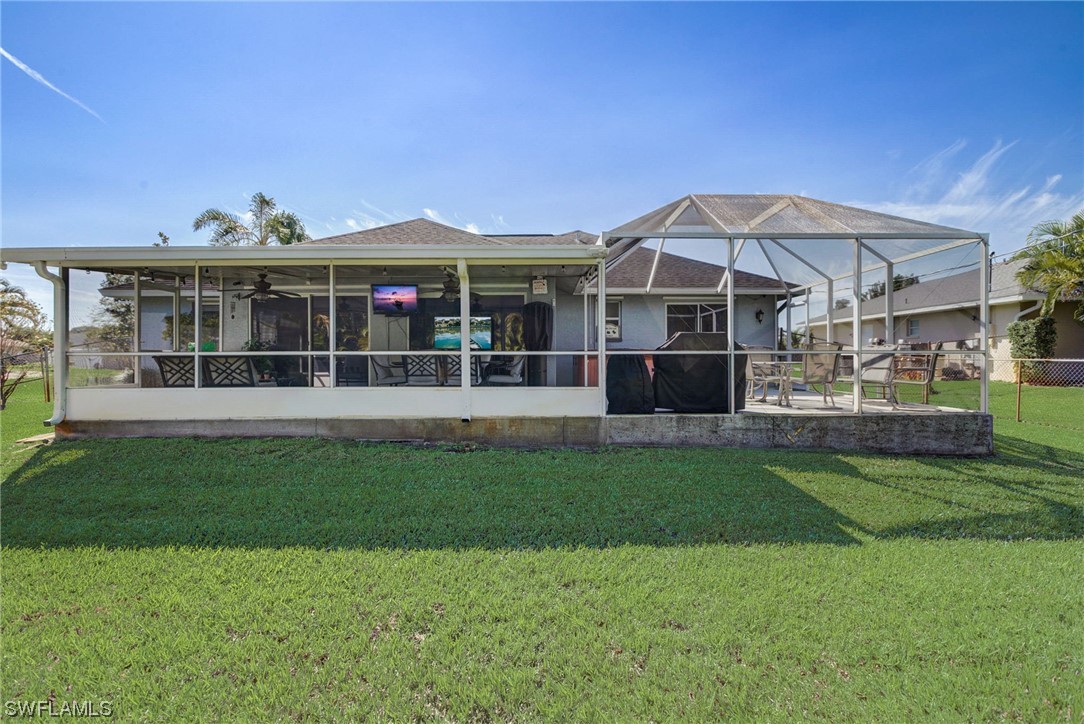 8337 Robin Road Fort Myers, FL 33967 - Photo 33 of 36 a front view of a house with a garden
