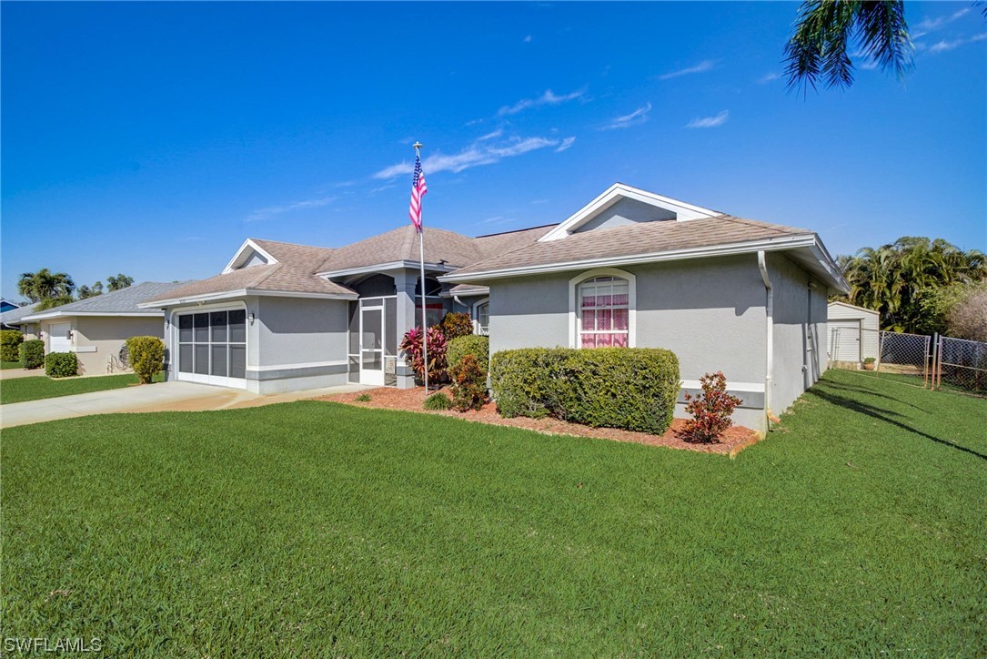 8337 Robin Road Fort Myers, FL 33967 - Photo 35 of 36 a front view of a house with a garden
