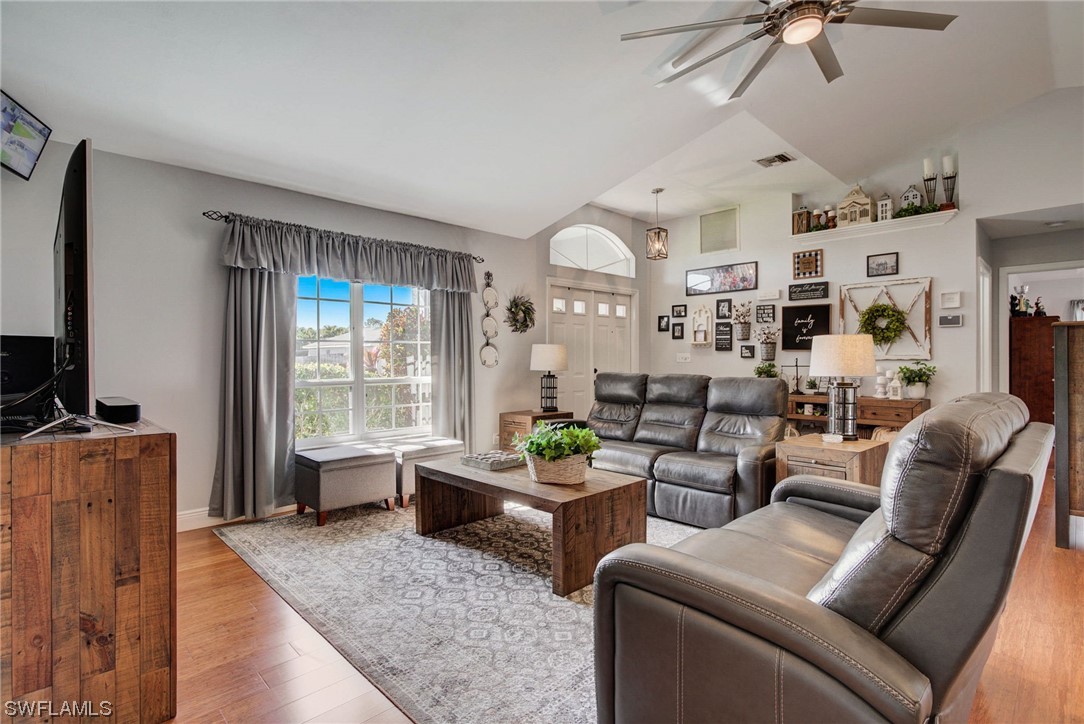 8337 Robin Road Fort Myers, FL 33967 - Photo 6 of 36 a living room with furniture large window and flat screen tv