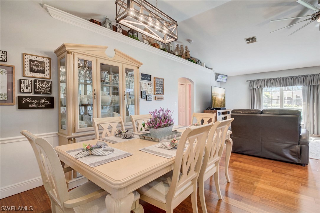 8337 Robin Road Fort Myers, FL 33967 - Photo 8 of 36 a view of a dining room with furniture window and wooden floor
