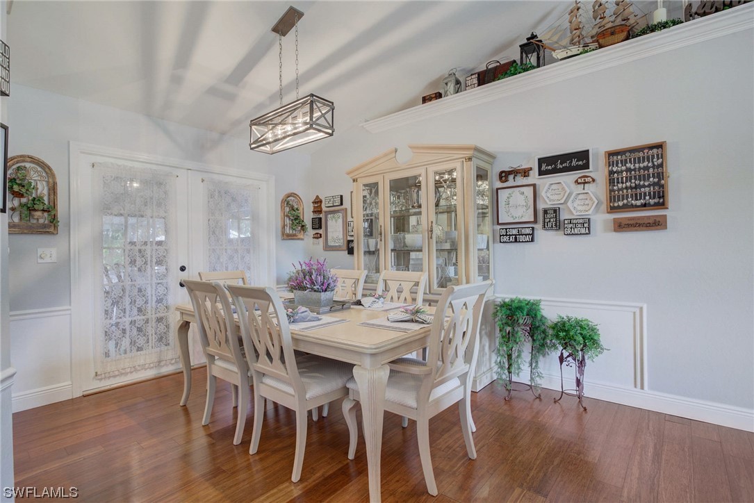 8337 Robin Road Fort Myers, FL 33967 - Photo 10 of 36 a view of a dining room with furniture and wooden floor