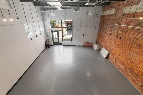 a view of a bathroom with a bathtub and window