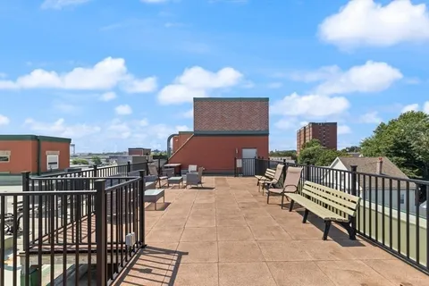 a view of a terrace with furniture