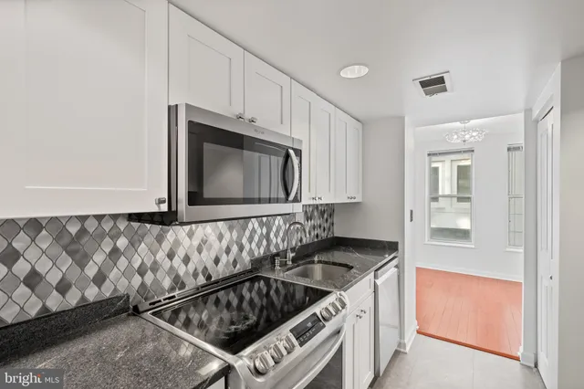 a kitchen with a stove and a microwave