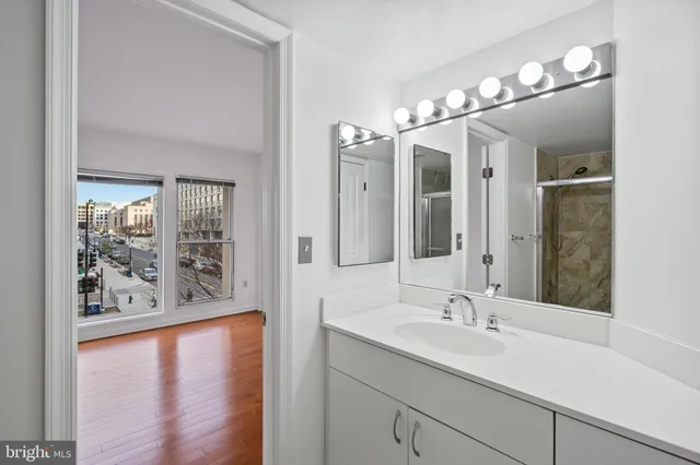 a bathroom with a sink double vanity and a mirror