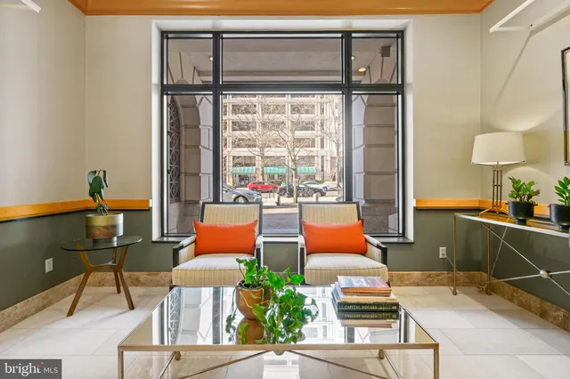 a living room with furniture and a window