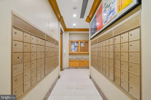 a view of a tall building next to a road