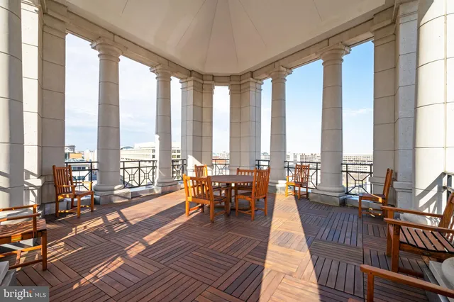 a view of a tall building next to a road