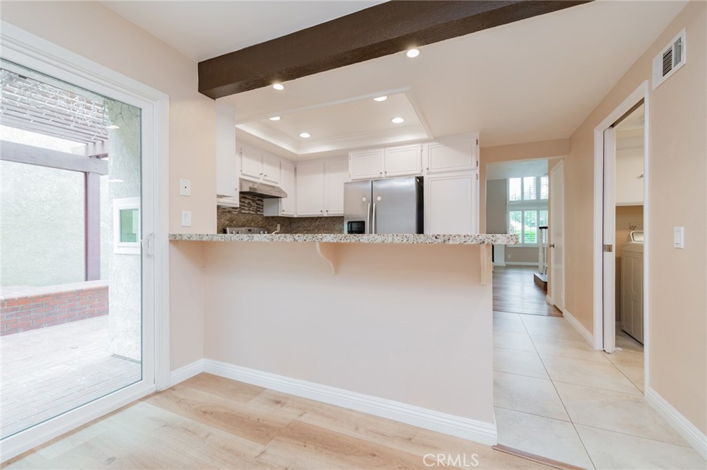 7 Tivoli Irvine, CA 92620 - Photo 13 of 29 a view of a kitchen with a refrigerator and a cabinets