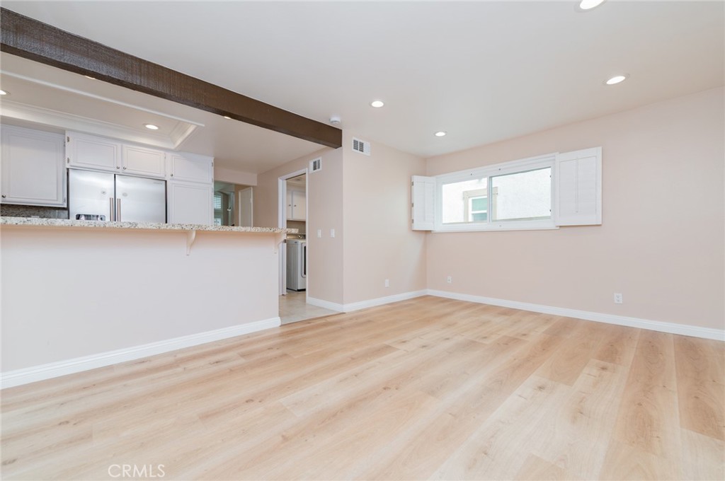 7 Tivoli Irvine, CA 92620 - Photo 15 of 29 a view of an empty room with window and wooden floor