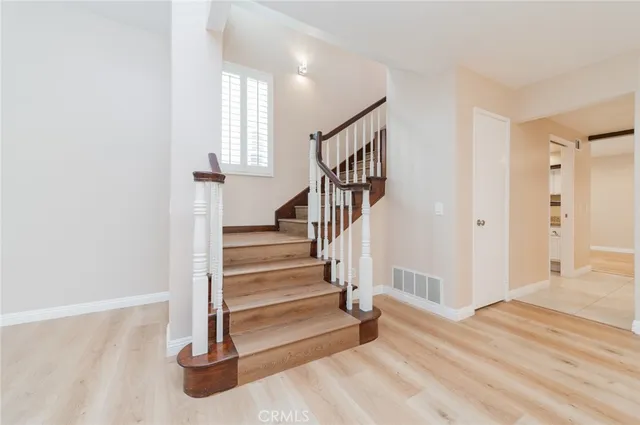 a view of an entryway with wooden floor