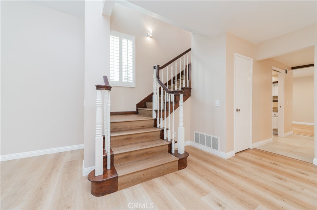 7 Tivoli Irvine, CA 92620 - Photo 18 of 29 a view of an entryway with wooden floor