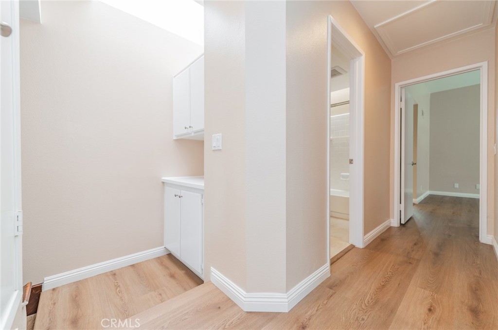 7 Tivoli Irvine, CA 92620 - Photo 19 of 29 a view of a hallway with wooden floor