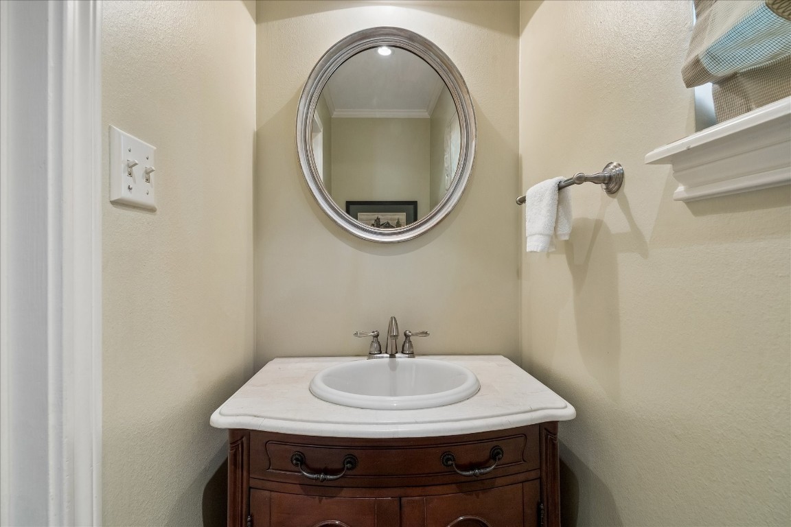 12206 Perthshire Road Houston, TX 77024 - Photo 17 of 30 The half-bath between the kitchen and the laundry room.
