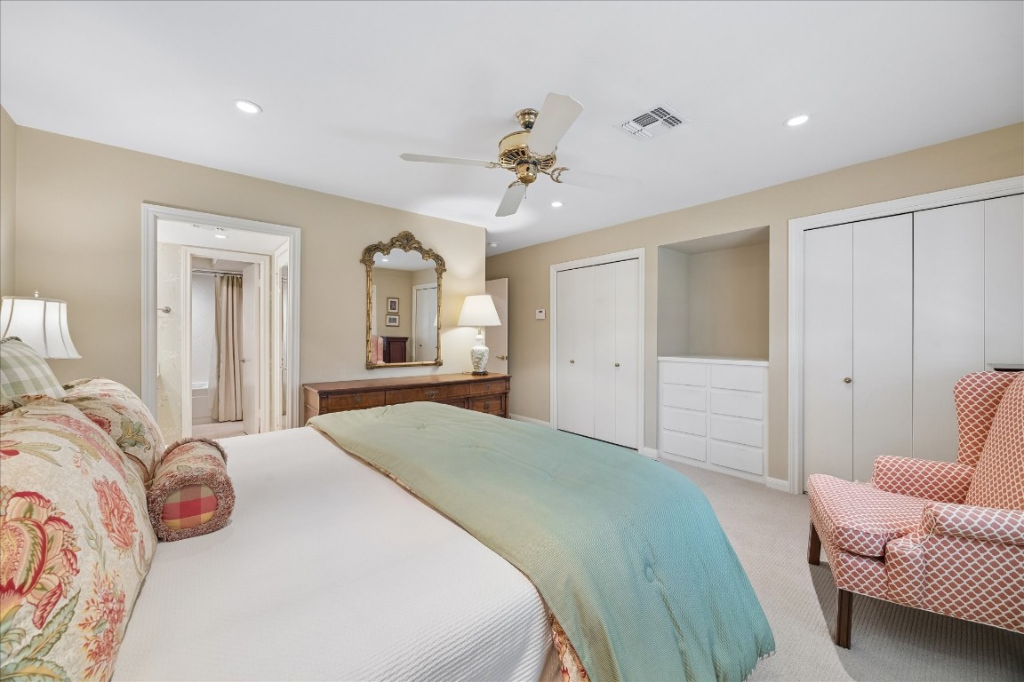 12206 Perthshire Road Houston, TX 77024 - Photo 20 of 30 The primary bedroom with built in storage space and natural light.