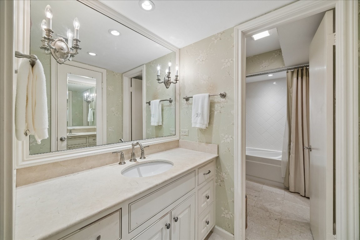 12206 Perthshire Road Houston, TX 77024 - Photo 21 of 30 Primary bathroom with combination shower and bathtub.