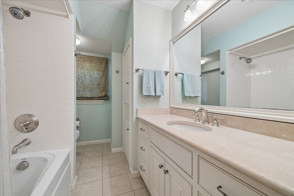 12206 Perthshire Road Houston, TX 77024 - Photo 26 of 30 Upstairs bathroom with combination shower/tub.