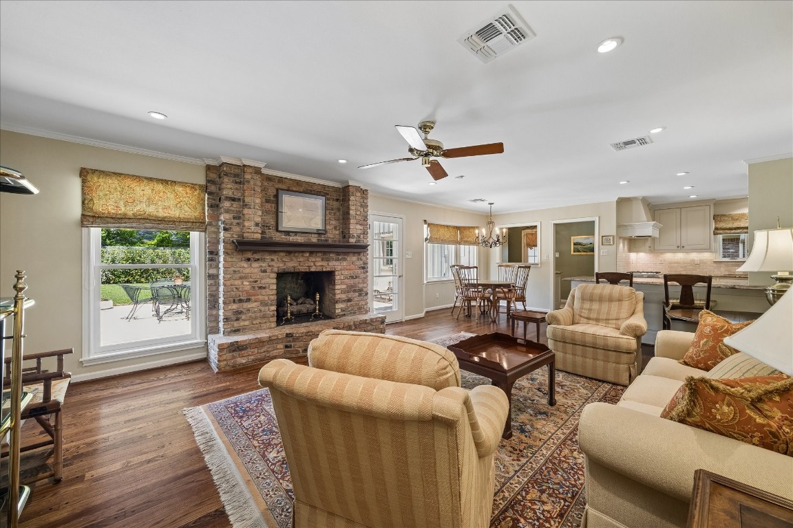 12206 Perthshire Road Houston, TX 77024 - Photo 4 of 30 Open family room with gas log fireplace.