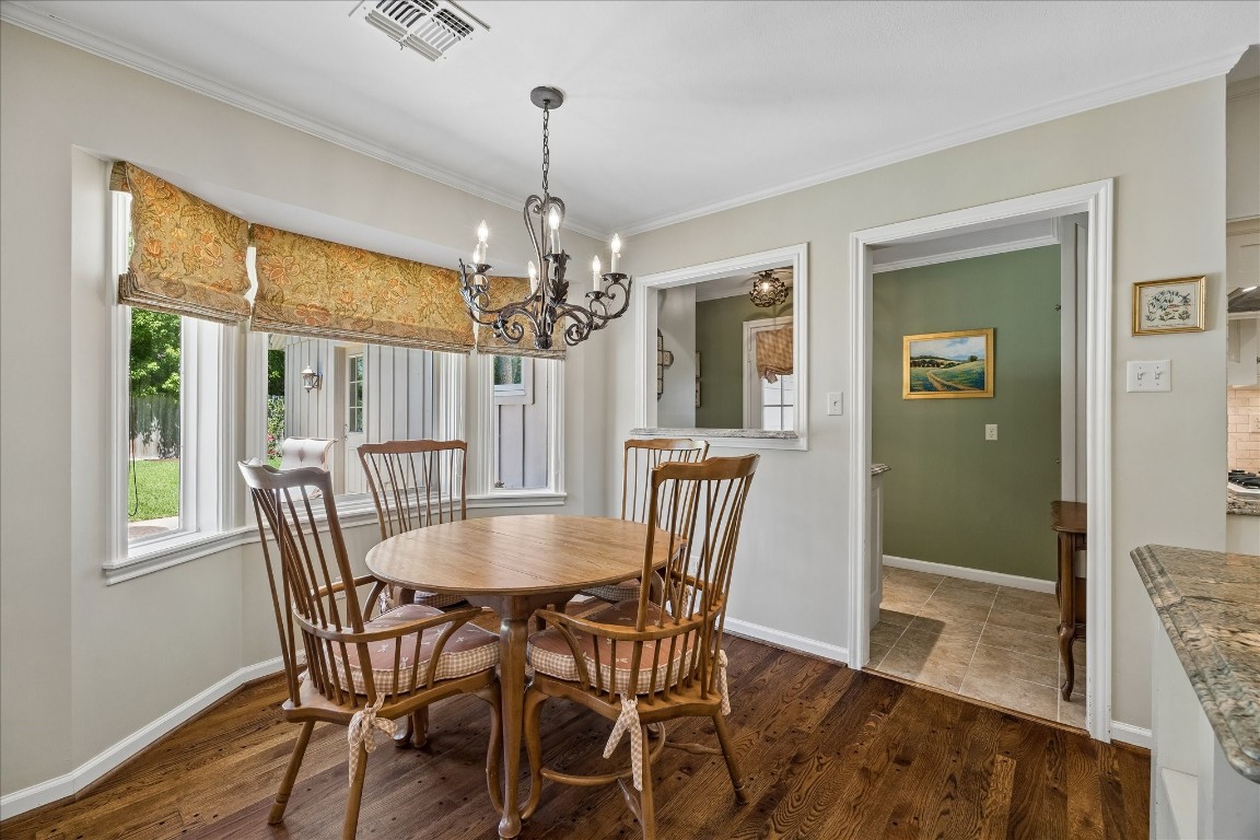 12206 Perthshire Road Houston, TX 77024 - Photo 8 of 30 Breakfast room with views into the wet bar and the backyard.
