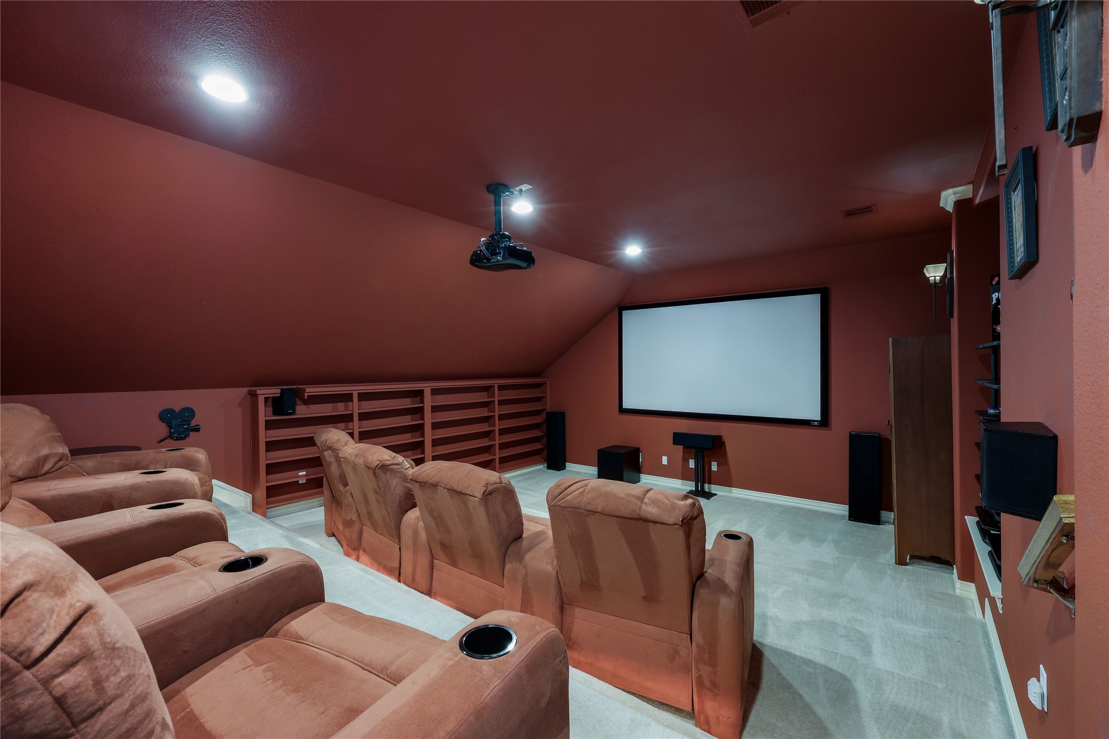 408 Ridgetop Bend Cedar Park, TX 78613 - Photo 34 of 40 Experience movies in comfort within this dedicated home media room featuring plush seating and an impressive screen.