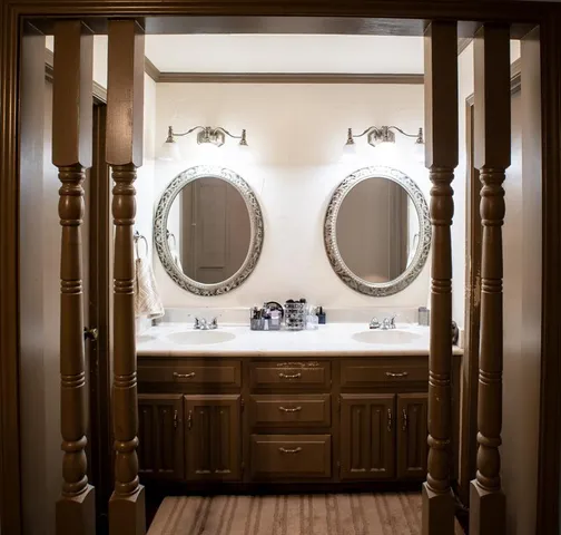 a bathroom with a sink a mirror and a bathtub