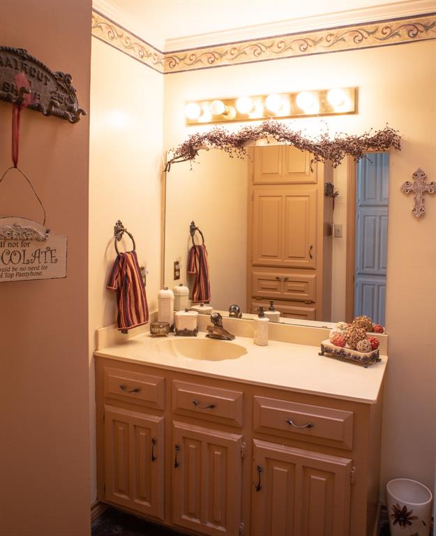 141 Lcr 405 Mexia, TX 76667 - Photo 38 of 40 a bathroom with a granite countertop sink and a mirror