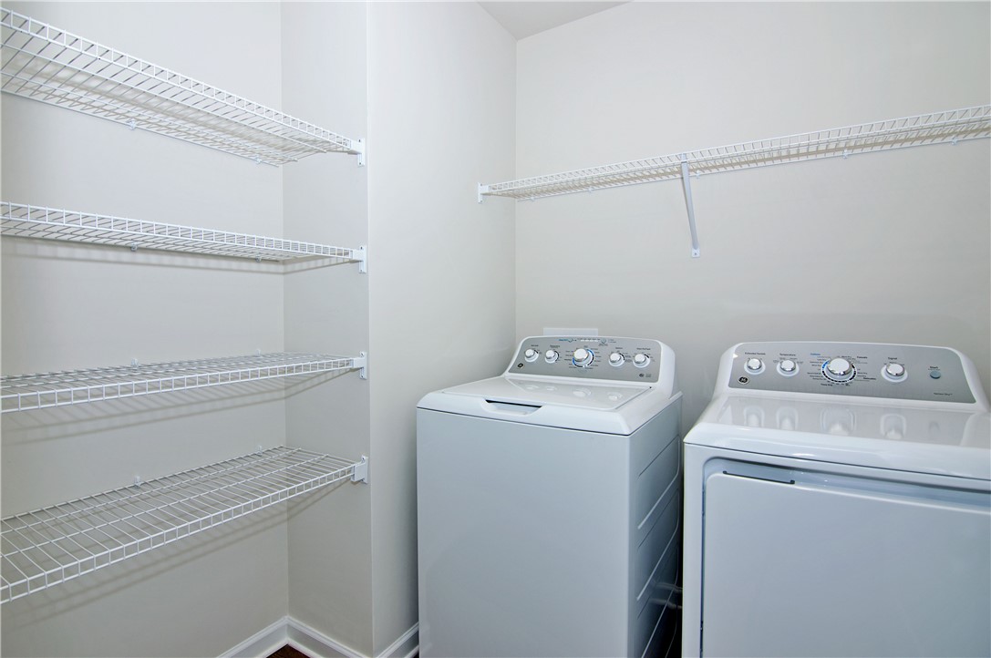 723 Peridot Way Westminster, SC 29693 - Photo 30 of 45 Functional laundry zone with integrated shelving offers practical household organization.